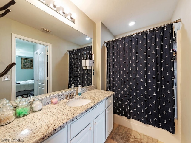 bathroom with shower / bathtub combination with curtain, tile floors, and large vanity