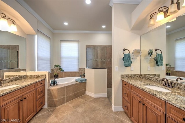 bathroom featuring ornamental molding, separate shower and tub, vanity, and tile patterned floors