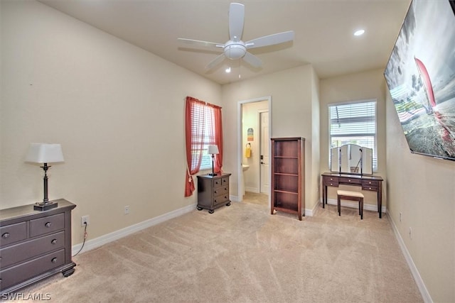 interior space with ceiling fan and light carpet