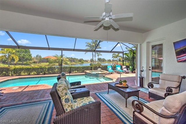 view of swimming pool with a lanai, ceiling fan, an outdoor living space, a patio area, and an in ground hot tub