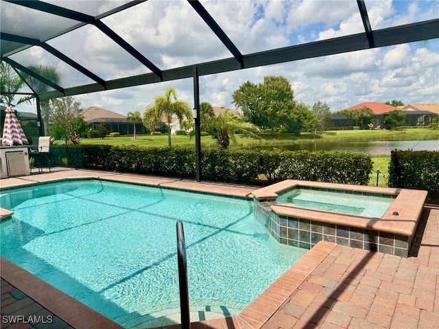 view of pool with an in ground hot tub, glass enclosure, and a patio area