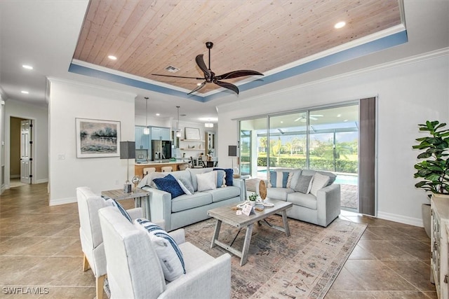 tiled living room featuring ornamental molding, wooden ceiling, ceiling fan, and a tray ceiling