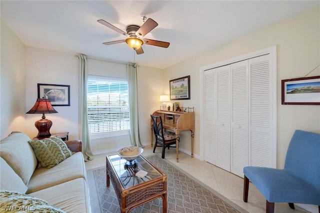 living room featuring light tile patterned flooring and ceiling fan