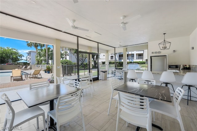 dining space with ceiling fan