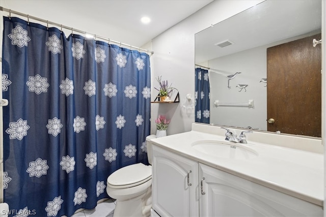 bathroom with oversized vanity and toilet