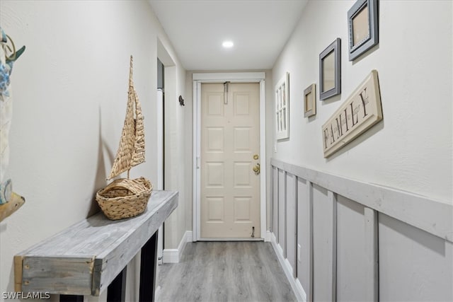 doorway to outside with light wood-type flooring