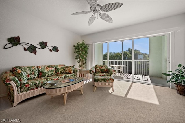 carpeted living room featuring ceiling fan