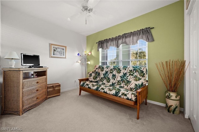 sitting room with light carpet and baseboards