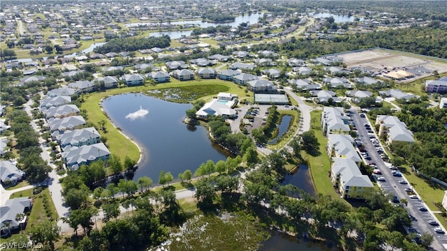 birds eye view of property featuring a residential view and a water view