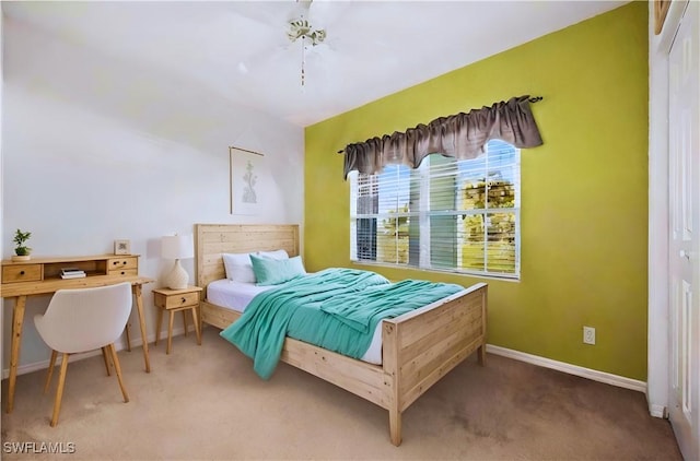 bedroom with carpet floors and baseboards