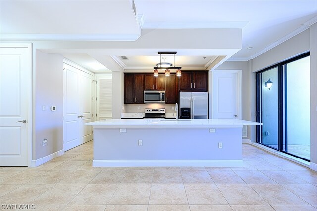 kitchen featuring a kitchen island with sink, appliances with stainless steel finishes, hanging light fixtures, and dark brown cabinetry