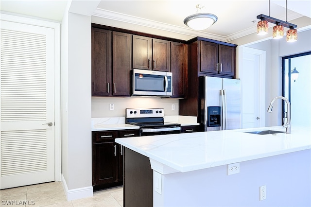 kitchen featuring dark brown cabinets, pendant lighting, stainless steel appliances, and sink