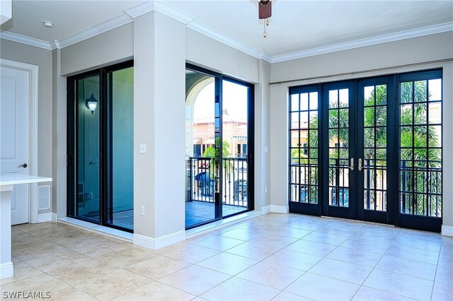 doorway to outside with french doors, crown molding, and light tile floors