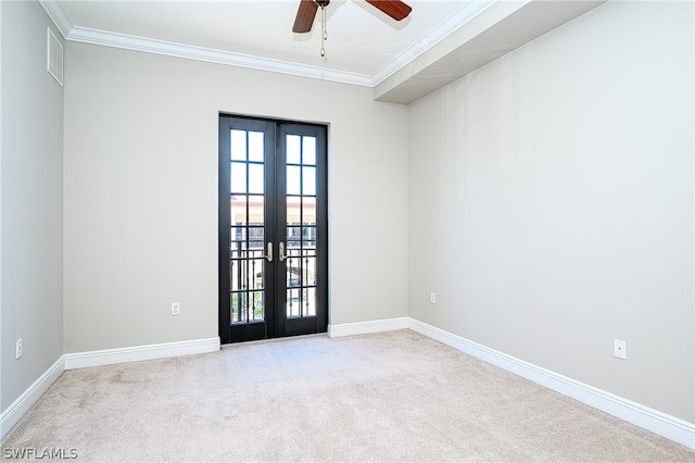 carpeted empty room with french doors, ornamental molding, and ceiling fan