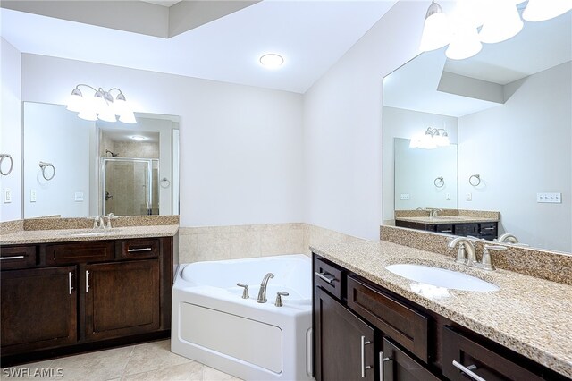 bathroom with tile flooring, dual vanity, and plus walk in shower