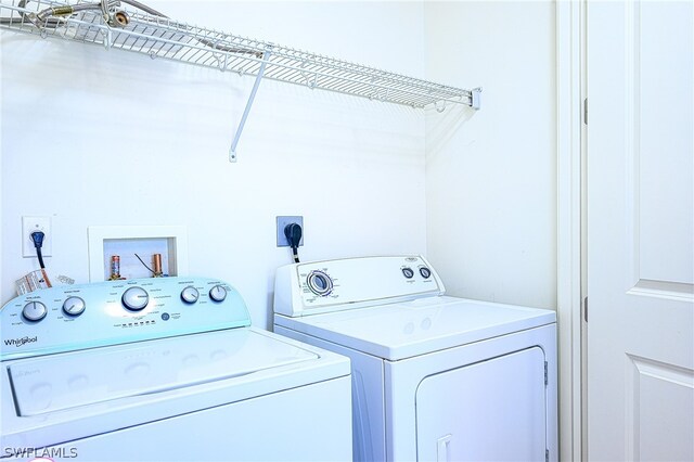 laundry room featuring independent washer and dryer, hookup for an electric dryer, and hookup for a washing machine