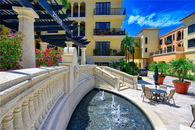 view of swimming pool with a pergola