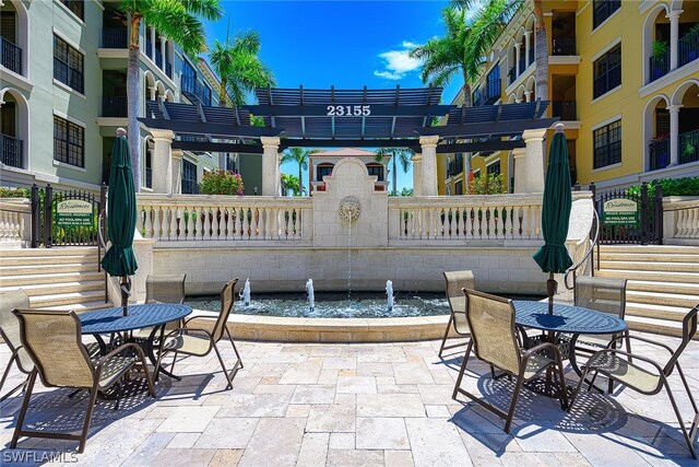 view of terrace with a pergola