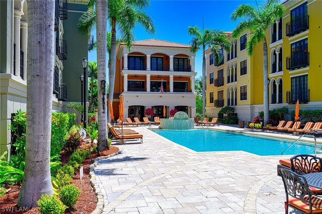 view of swimming pool featuring a patio area