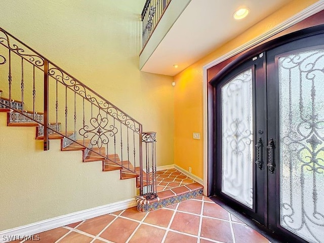 tiled entrance foyer with french doors