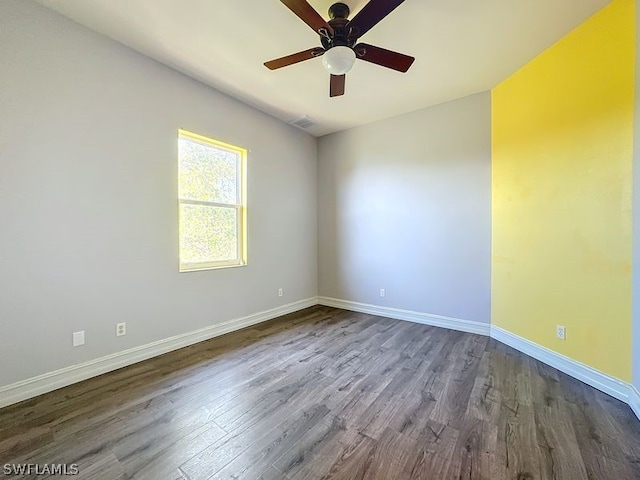 unfurnished room featuring hardwood / wood-style floors and ceiling fan