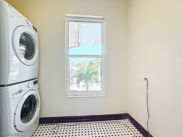 laundry area with stacked washer / dryer