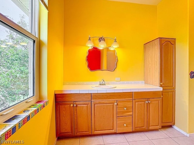 bathroom featuring vanity with extensive cabinet space and tile floors