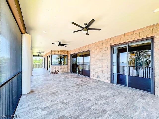 deck with a patio and ceiling fan