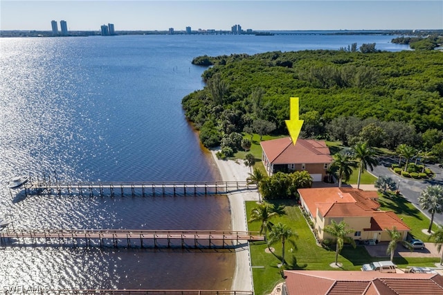 birds eye view of property featuring a water view