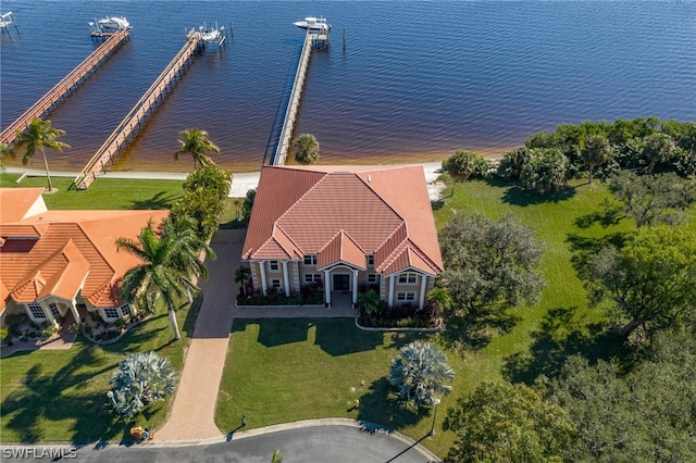 birds eye view of property with a water view