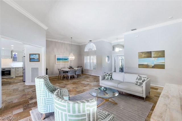 living room with ornamental molding and light tile floors