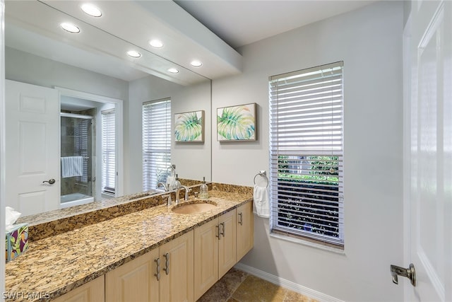 bathroom featuring vanity with extensive cabinet space and tile floors