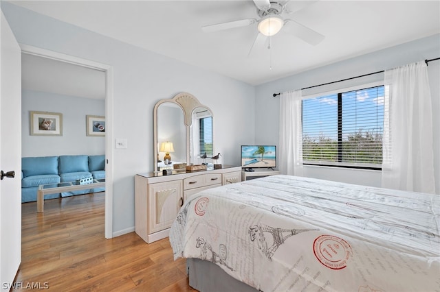 bedroom featuring light hardwood / wood-style floors and ceiling fan