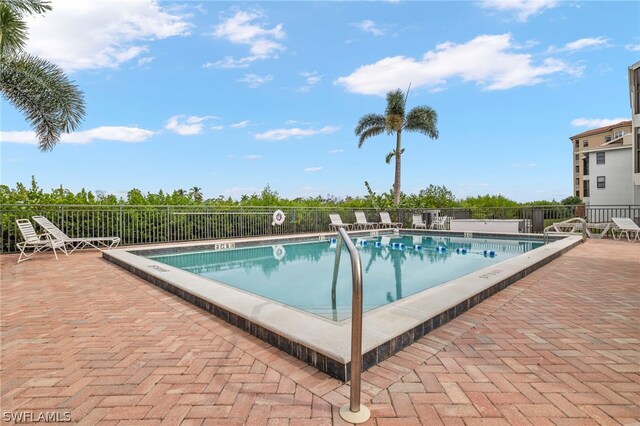 view of swimming pool featuring a patio area