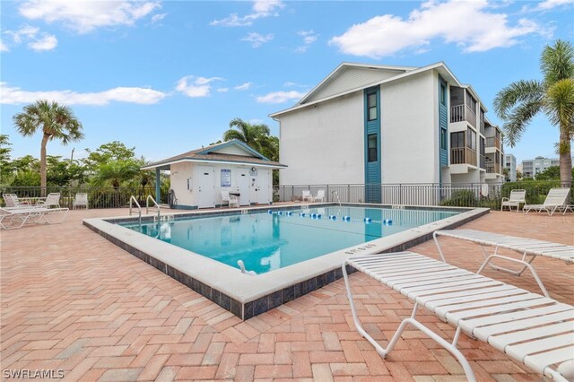 view of swimming pool featuring a patio area