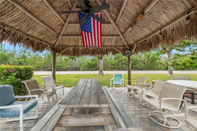 view of patio with ceiling fan and a gazebo