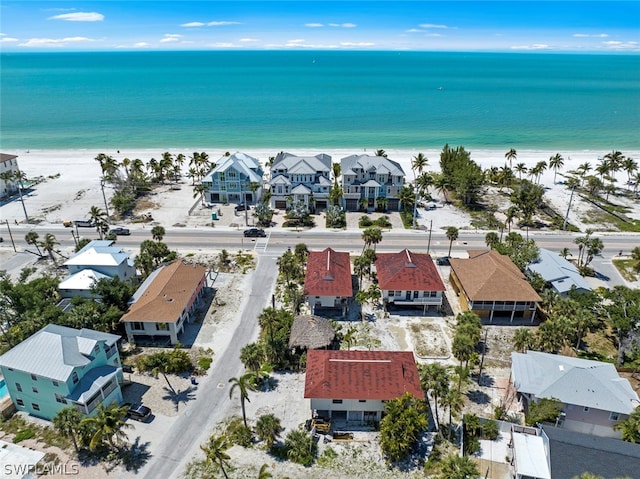 aerial view with a view of the beach and a water view