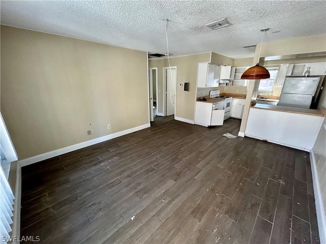 kitchen with dark hardwood / wood-style flooring, white cabinets, hanging light fixtures, and white appliances