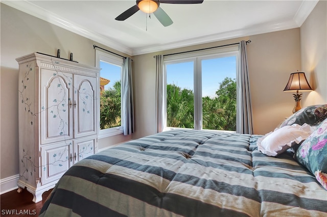 bedroom with wood-type flooring, ceiling fan, and crown molding