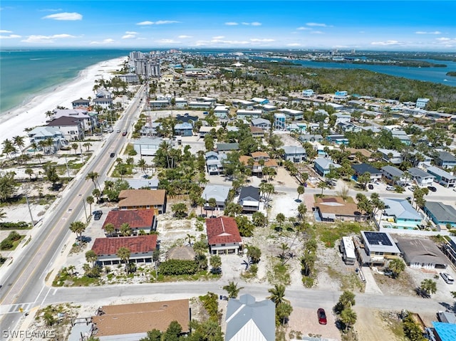 bird's eye view featuring a water view and a view of the beach