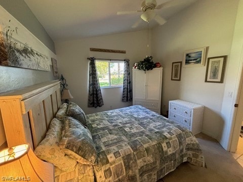 carpeted bedroom featuring ceiling fan and lofted ceiling