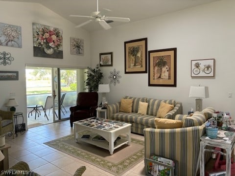 tiled living room with ceiling fan and vaulted ceiling