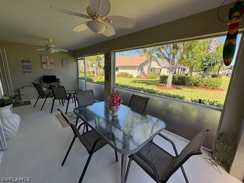 sunroom featuring ceiling fan