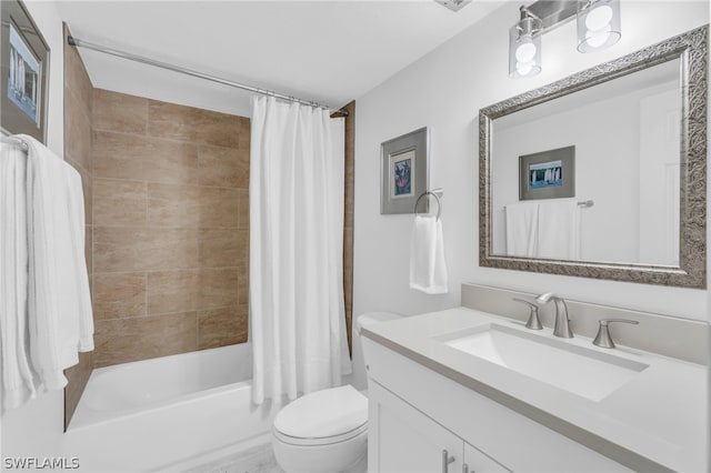 full bathroom with shower / bath combo, vanity, and toilet