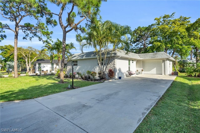 single story home featuring a front yard and a garage