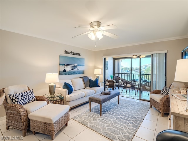 living room featuring ceiling fan, light tile flooring, and ornamental molding