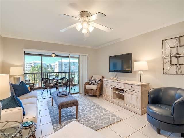 living room featuring ceiling fan, crown molding, and light tile floors