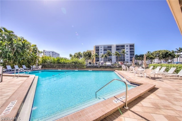 view of swimming pool with a patio