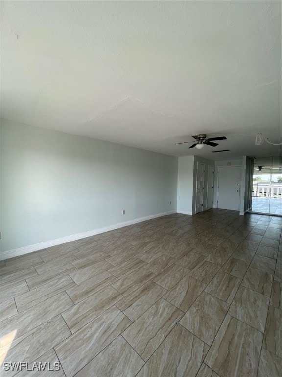 unfurnished living room featuring ceiling fan