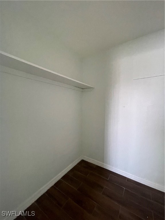 empty room featuring dark hardwood / wood-style flooring